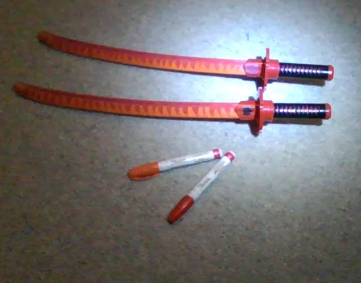 I redid my little bro's plastic Deadpool swords with paint marker